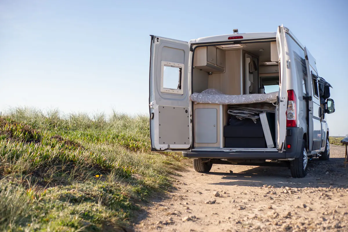 Camper in an open summer landscape